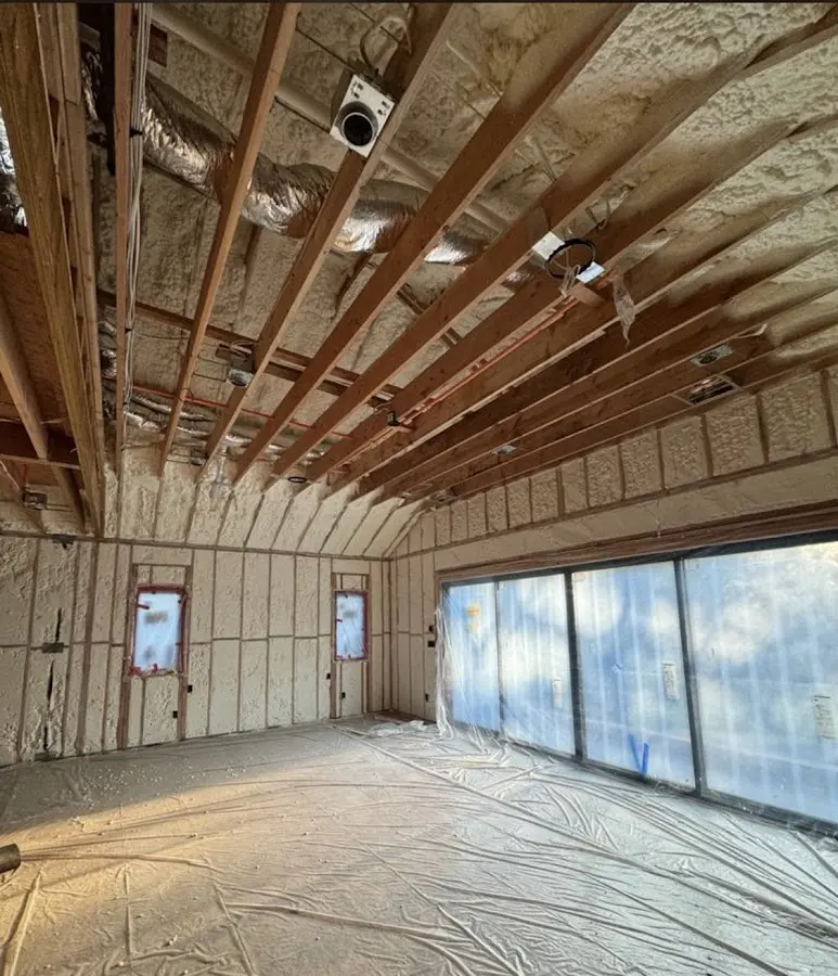 Interior walls and ceiling insulated with spray foam during new construction in Willoughby Hills